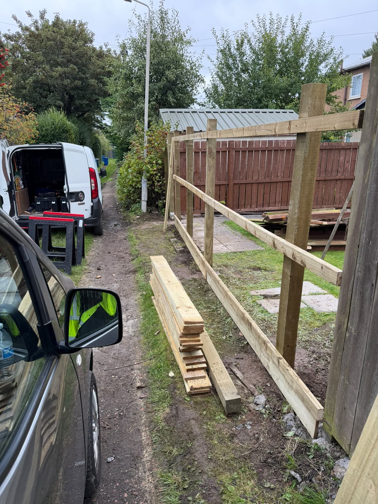 Post and rail frame for the replacement fence running the length of the boundary before the close-board cladding goes on