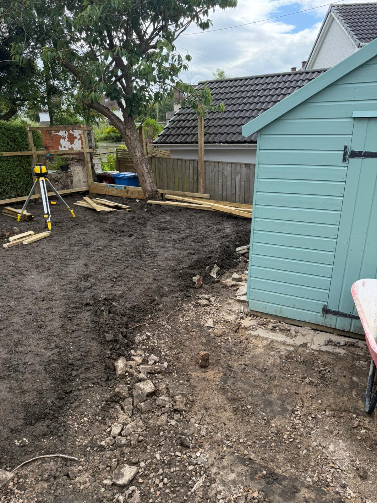 Spoil and old material cleared from a rear garden during the strip-out stage